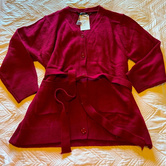 BloomChic Sweaters - Brand new maroon button up cardigan with tie waist sash. Size 22-24.